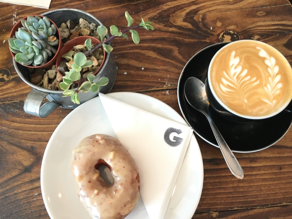 Peanut butter doughnut with a flat white