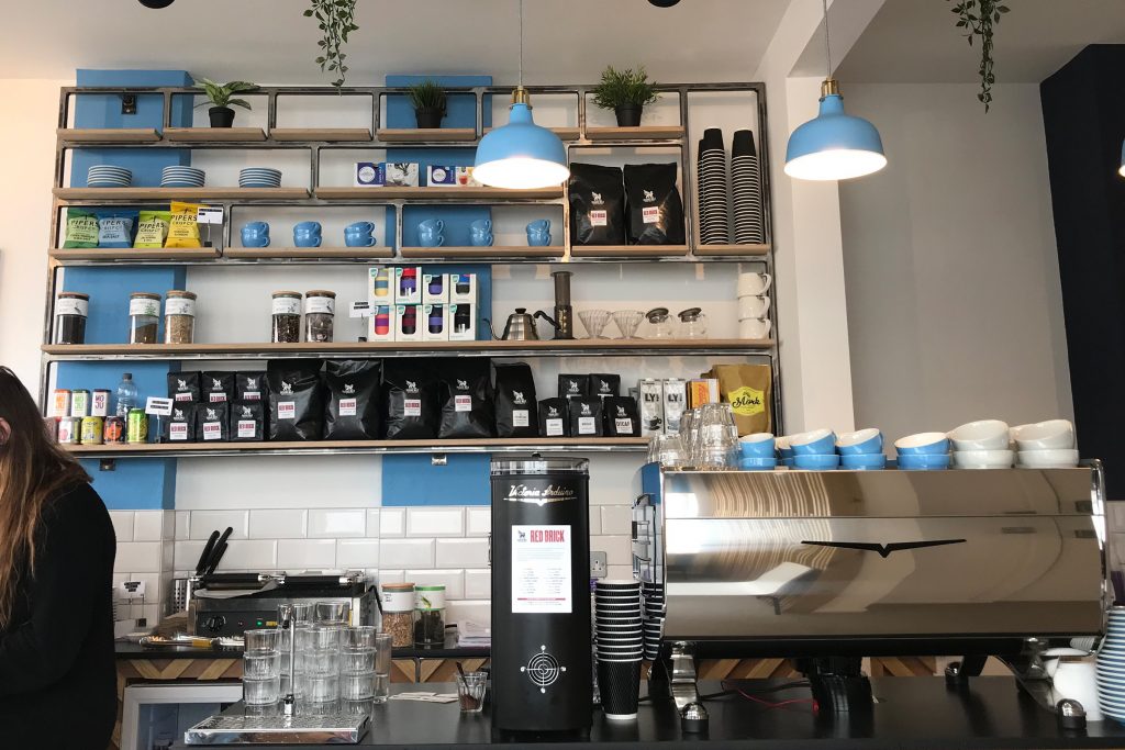 A view of the shelves behind the coffee counter
