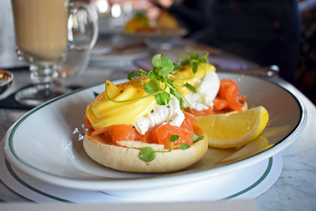 Breakfast at The Ivy: Eggs Royale with a wedge of lemon Breakfast at The Ivy: Eggs Royale with a wedge of lemon